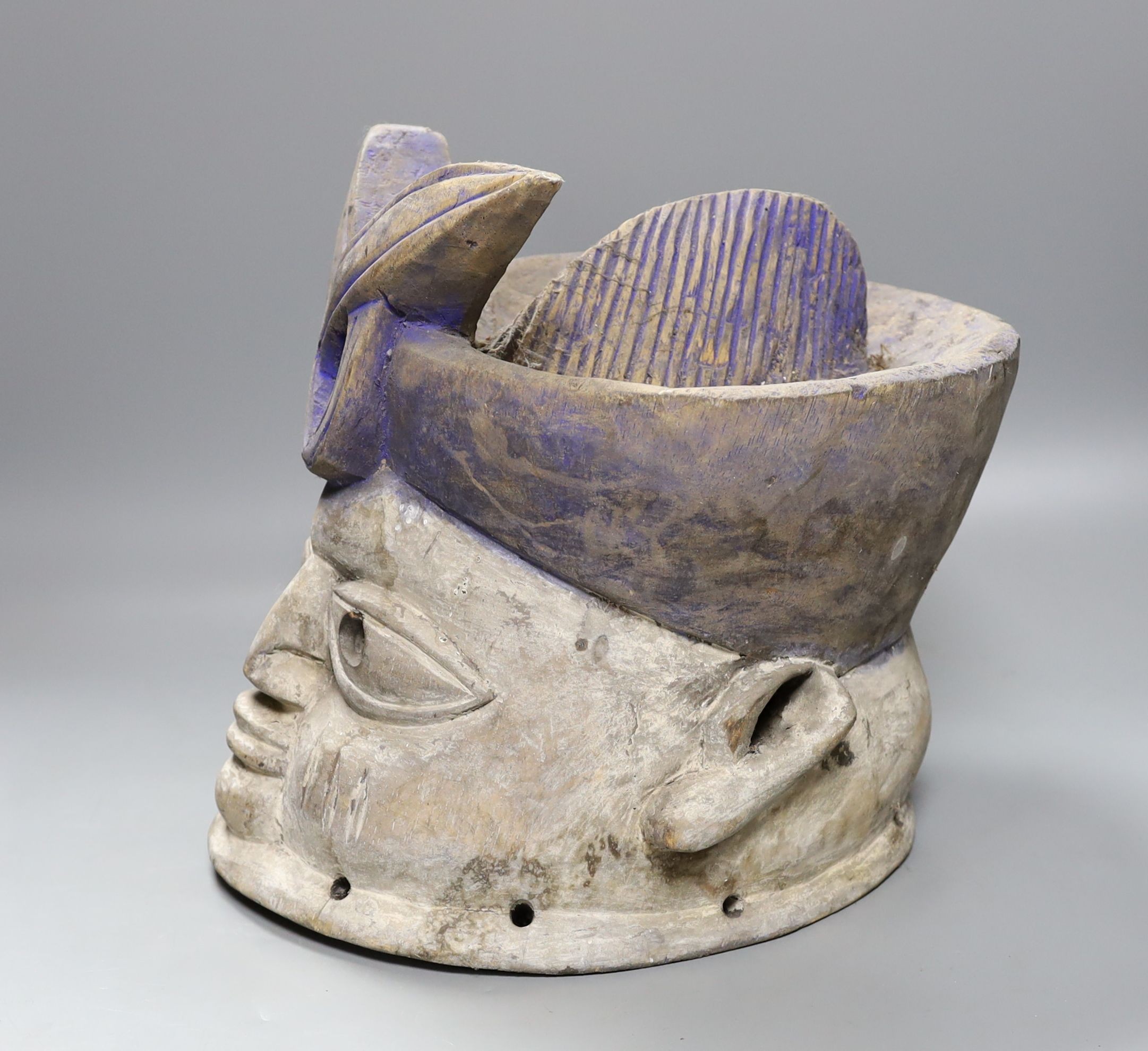 A Nigerian carved wood tribal mask, 30 cms high.